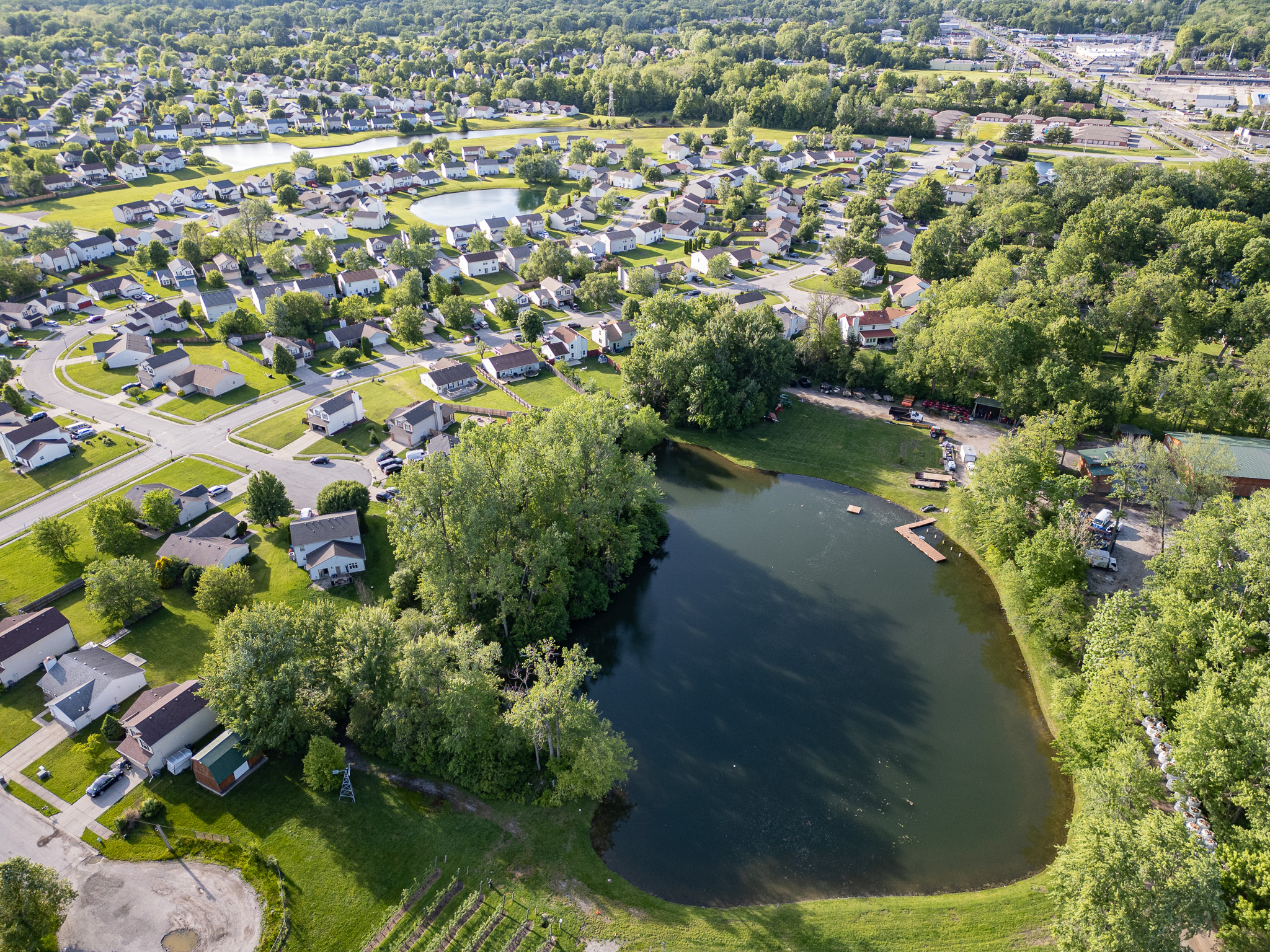 Aerial — neighborhood pond